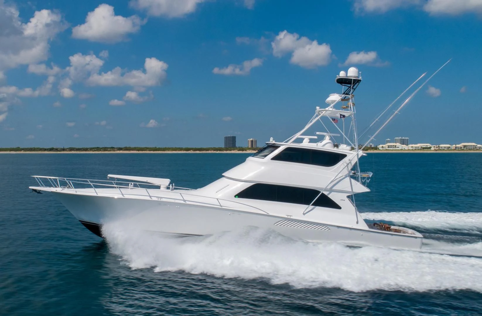 a white yacht on the water aboard HOME RUN Yacht for Sale