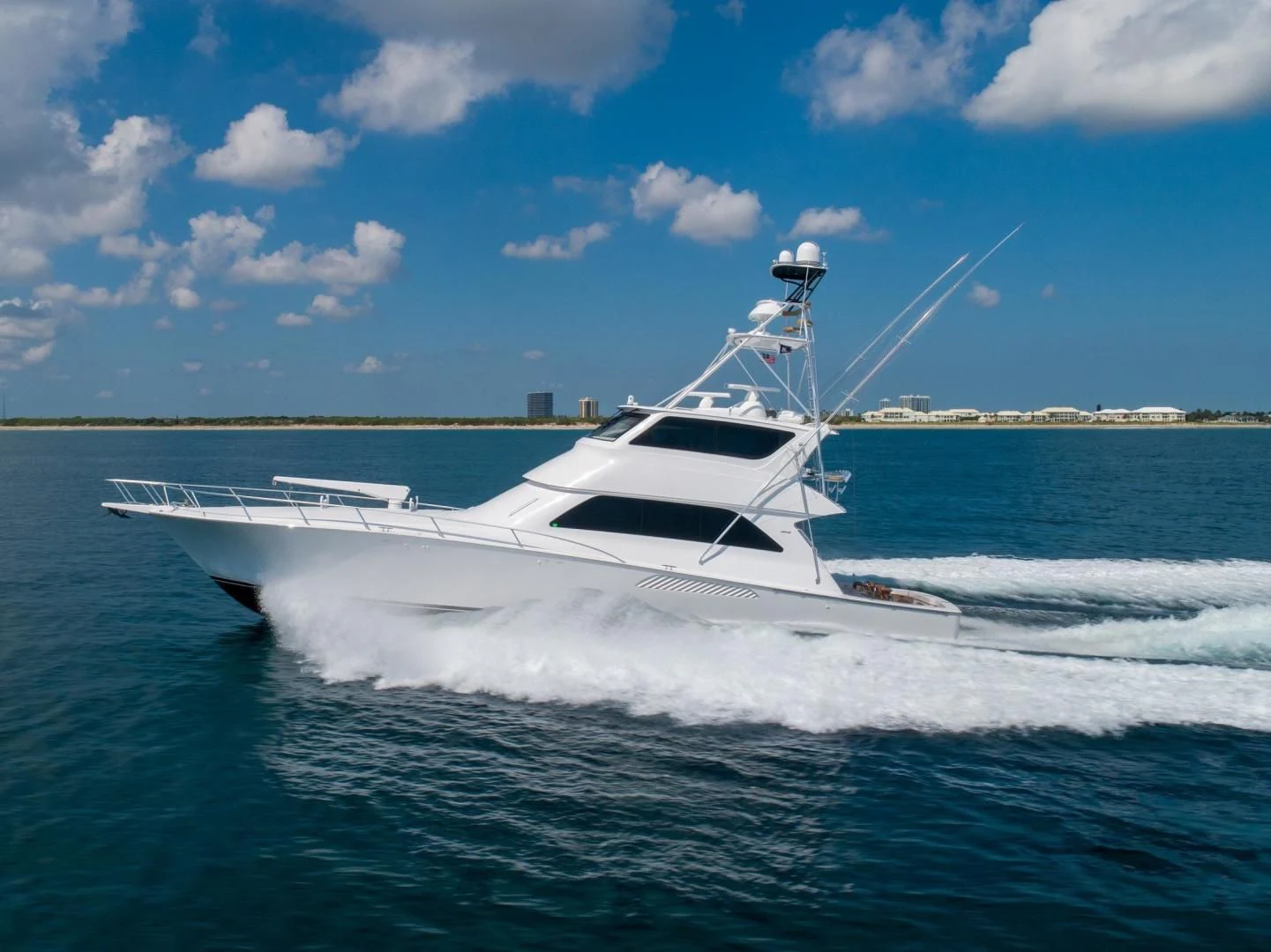 a white boat on the water aboard HOME RUN Yacht for Sale