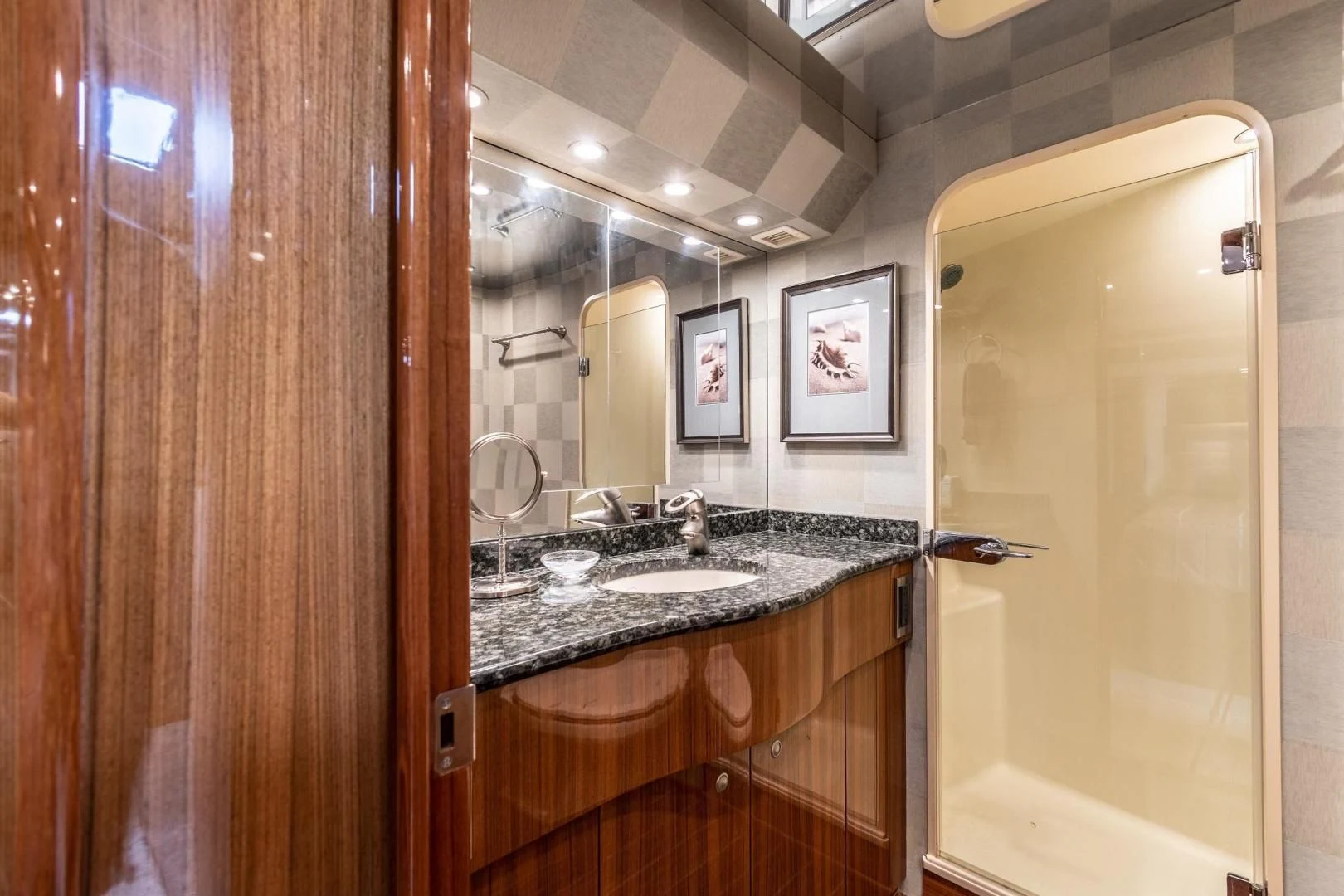 a bathroom with a sink and a mirror aboard HOME RUN Yacht for Sale