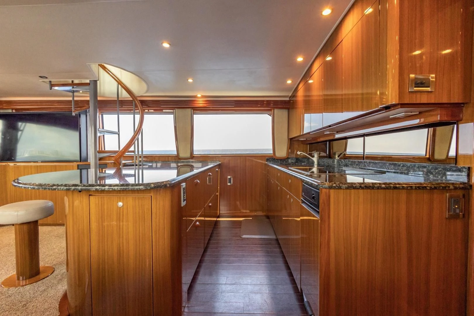 a kitchen with wooden cabinets aboard HOME RUN Yacht for Sale