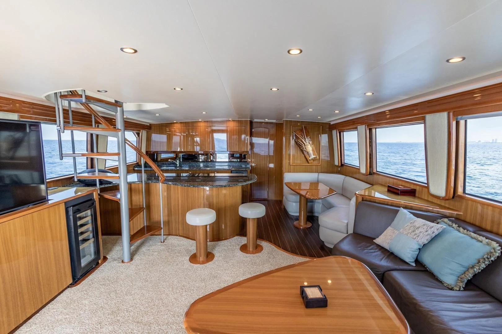 a living room with a large window aboard HOME RUN Yacht for Sale