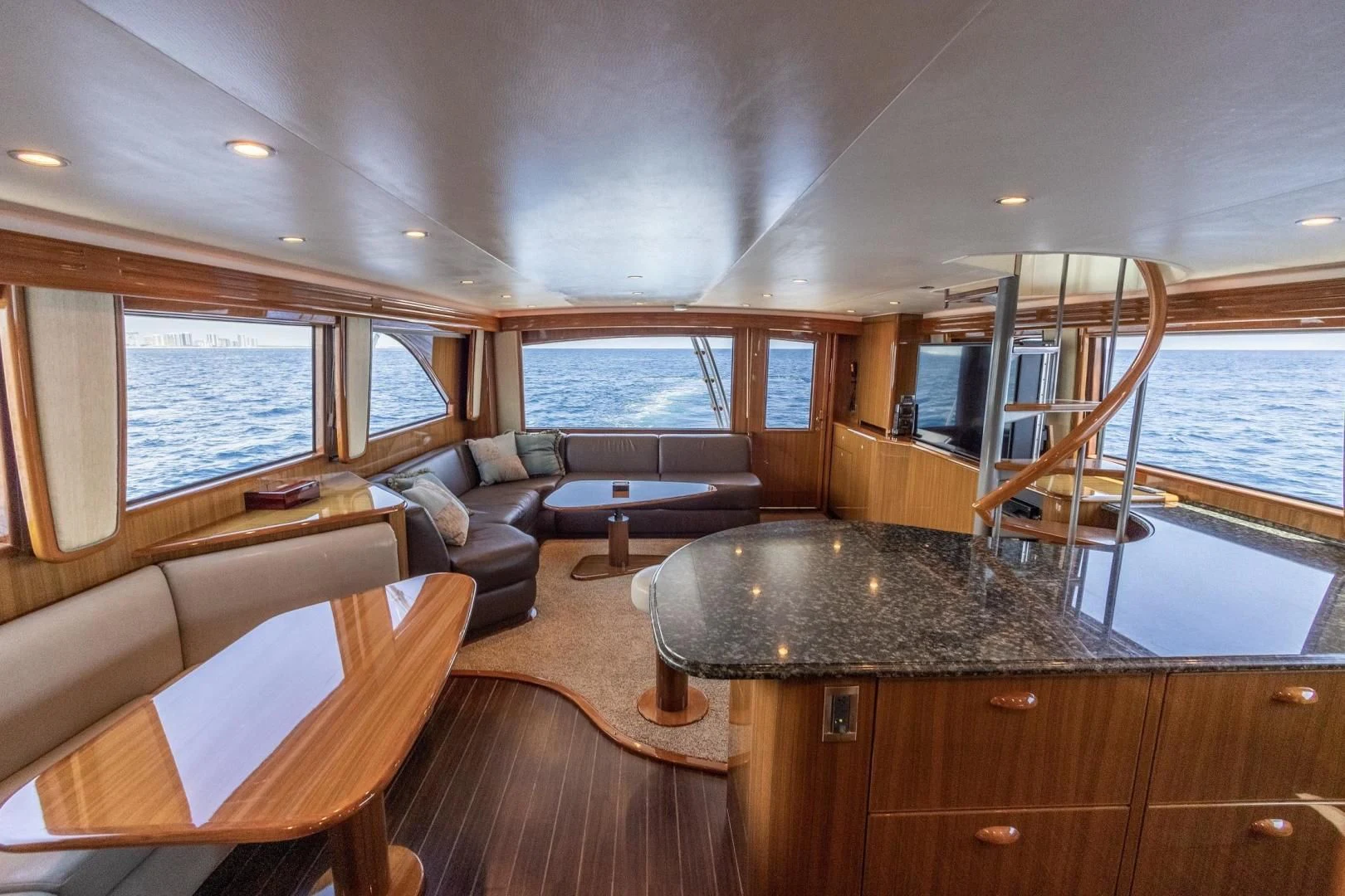a living room with a large window aboard HOME RUN Yacht for Sale