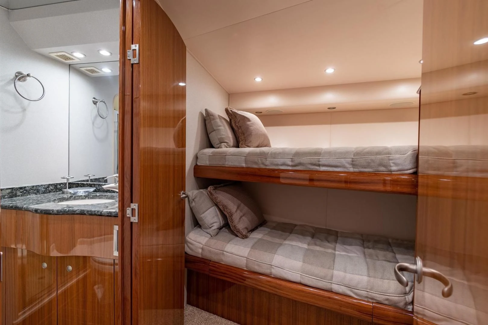 a room with a bed and a mirror aboard HOME RUN Yacht for Sale