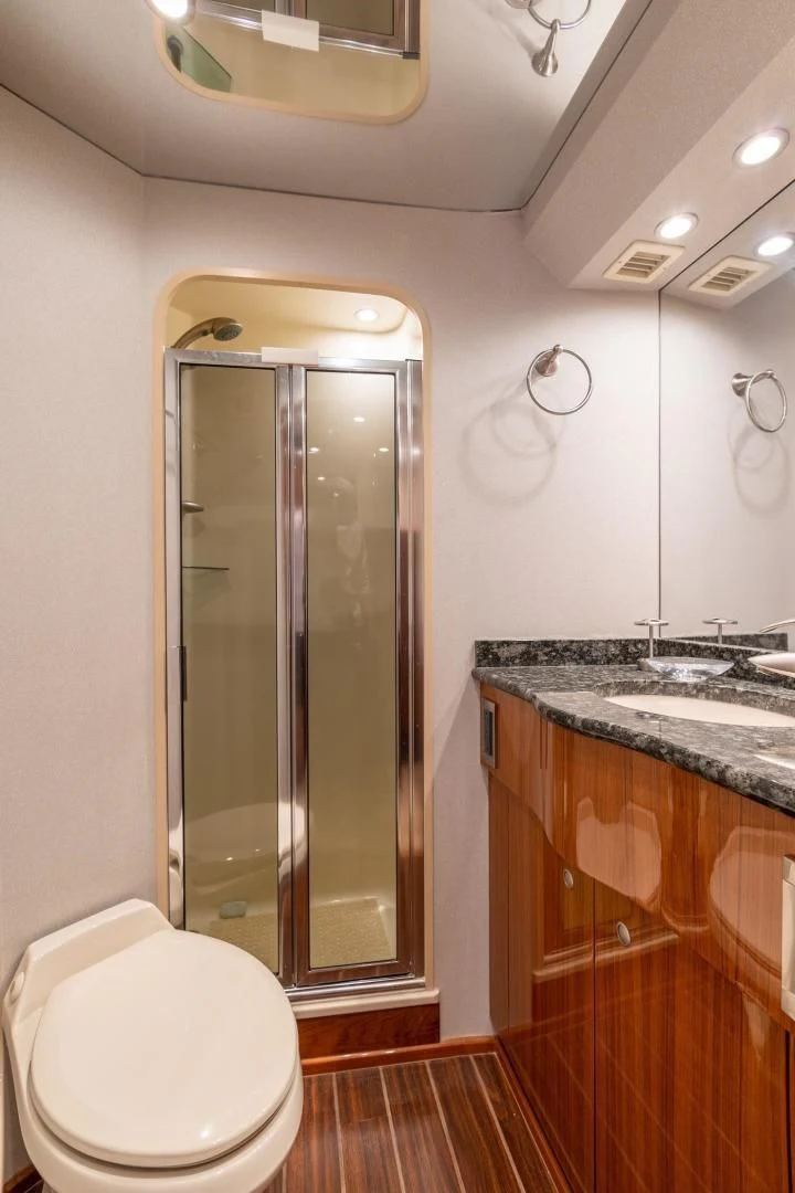a bathroom with a glass shower aboard HOME RUN Yacht for Sale