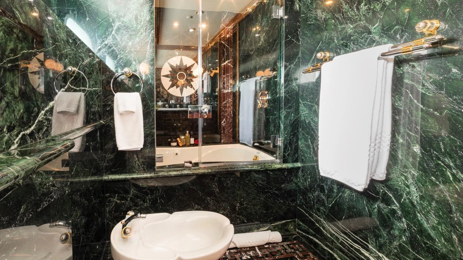 a bathroom with a green wall aboard POPEYE Yacht for Sale