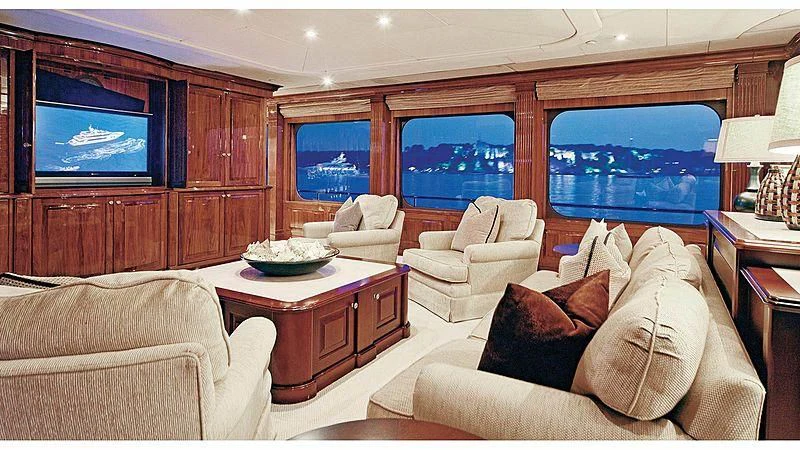 a living room with a large television aboard POPEYE Yacht for Sale