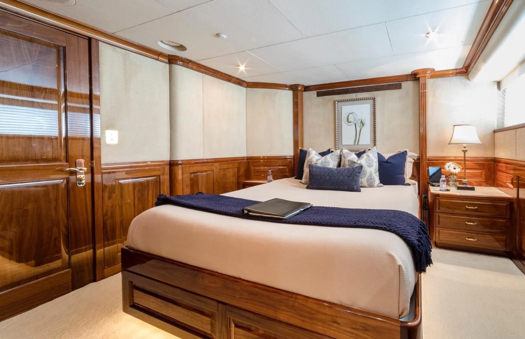 a bedroom with a bed and a desk aboard POPEYE Yacht for Sale