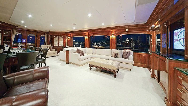a living room with a large mirror aboard POPEYE Yacht for Sale