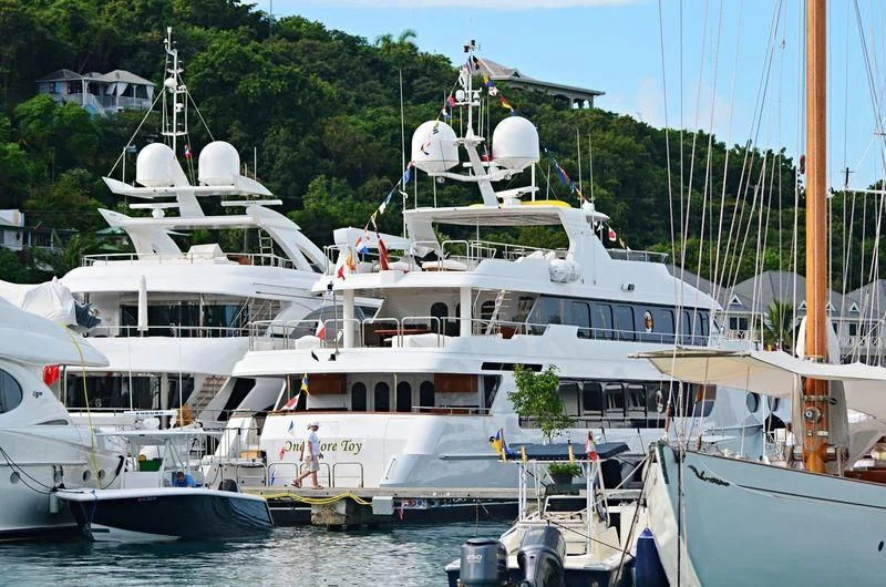 a group of boats are parked in a harbor aboard POPEYE Yacht for Sale