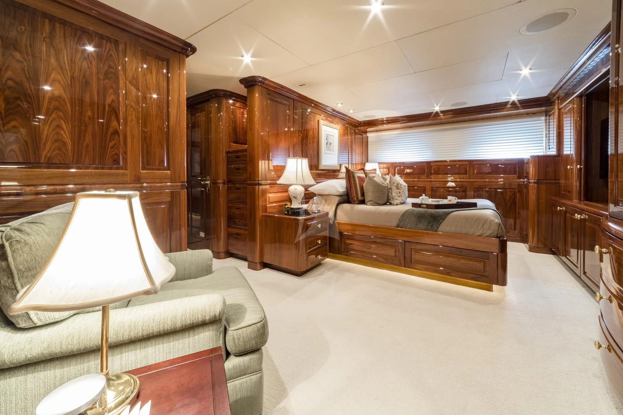 a large bedroom with a bed and a couch aboard POPEYE Yacht for Sale