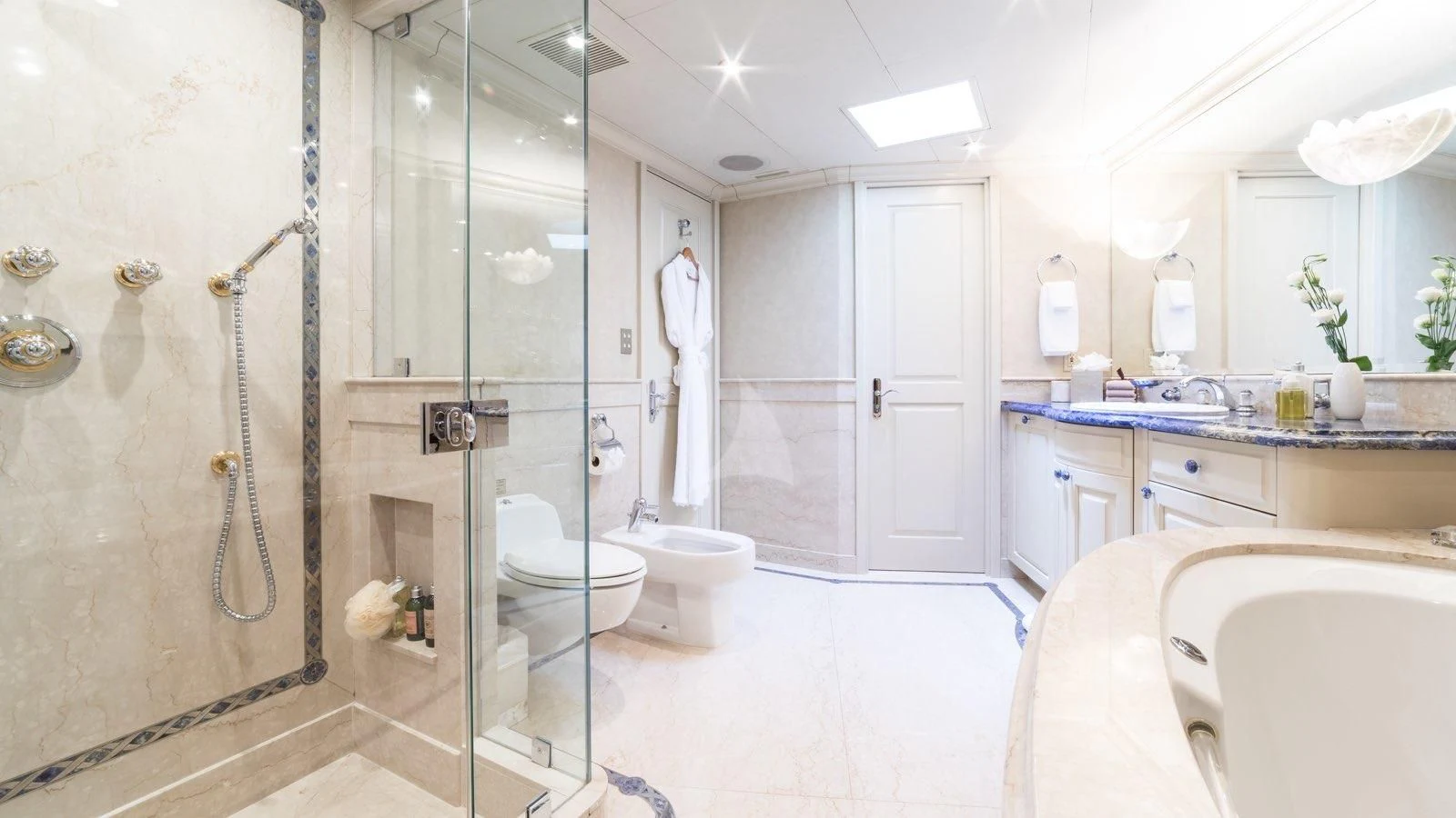 a bathroom with a glass shower aboard POPEYE Yacht for Sale