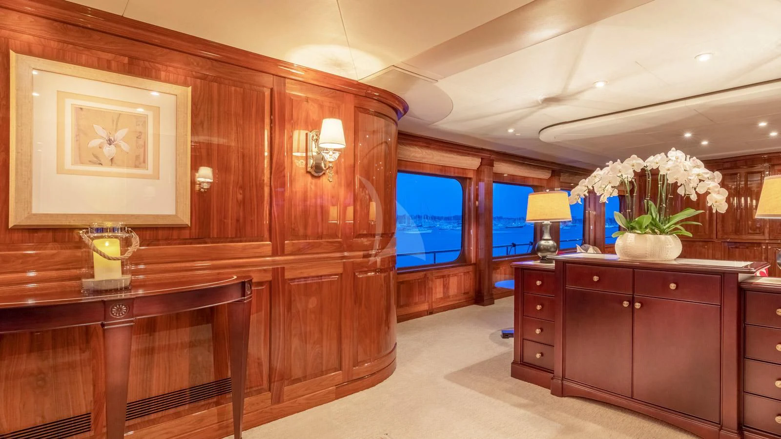 a room with a wood cabinet and a television in it aboard POPEYE Yacht for Sale