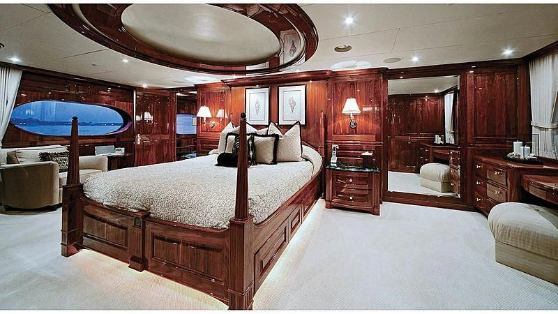 a large bedroom with a large bed aboard POPEYE Yacht for Sale