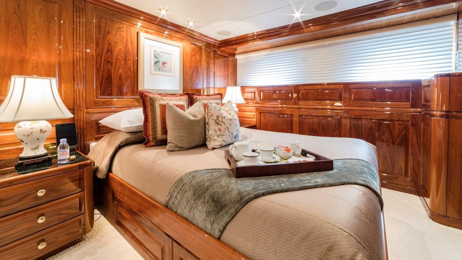 a bed with a tray of food on it aboard POPEYE Yacht for Sale