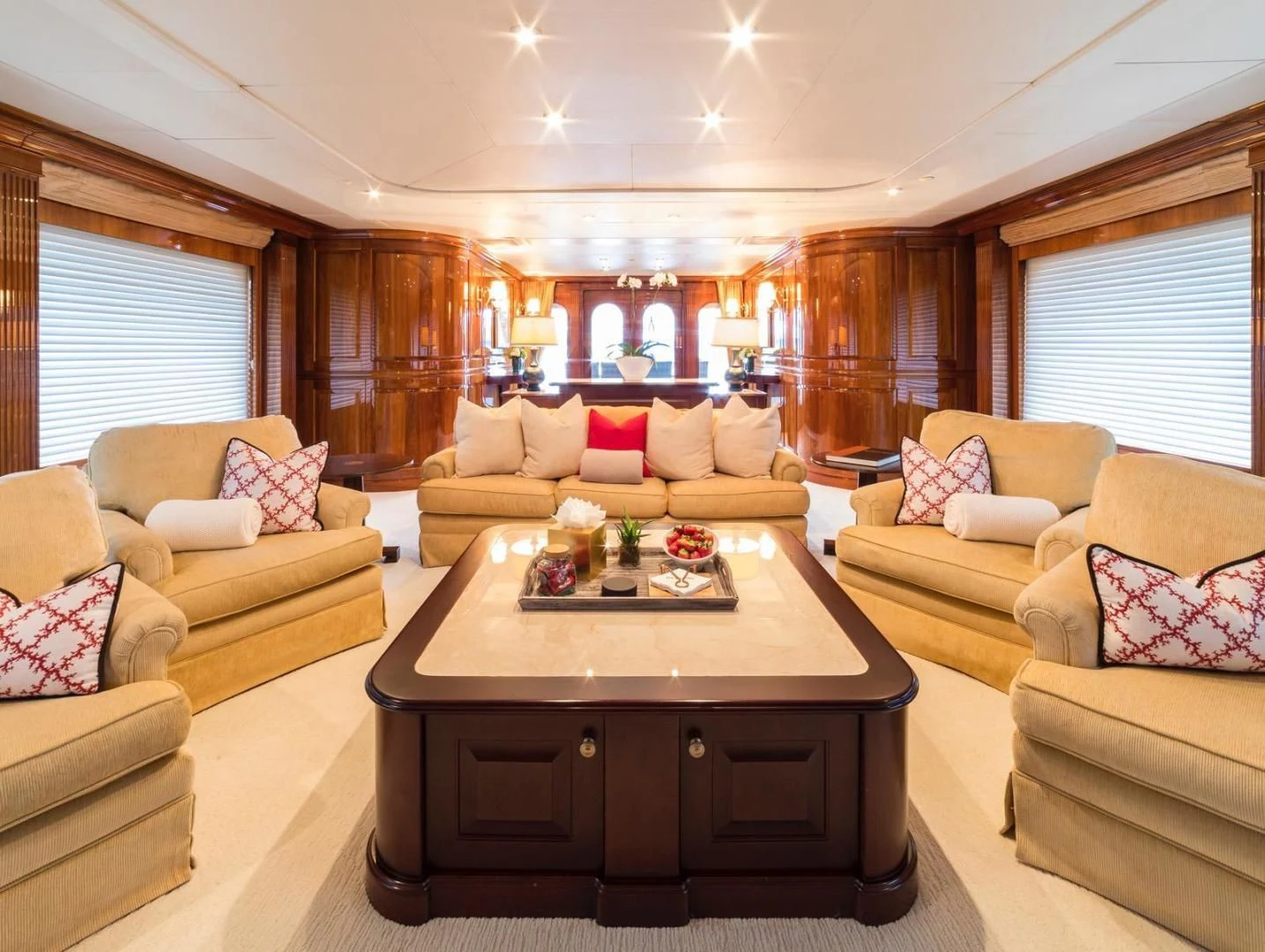 a living room with a table and couches aboard POPEYE Yacht for Sale