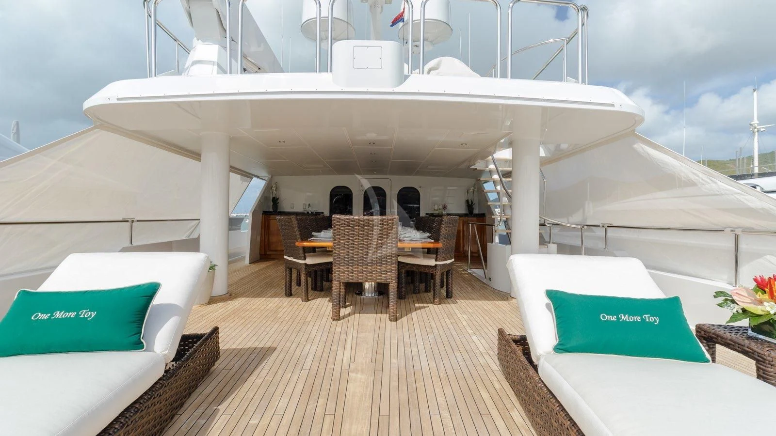 a boat with tables and chairs aboard POPEYE Yacht for Sale