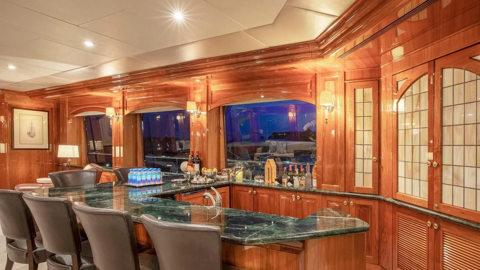a bar with a bar and chairs aboard POPEYE Yacht for Sale