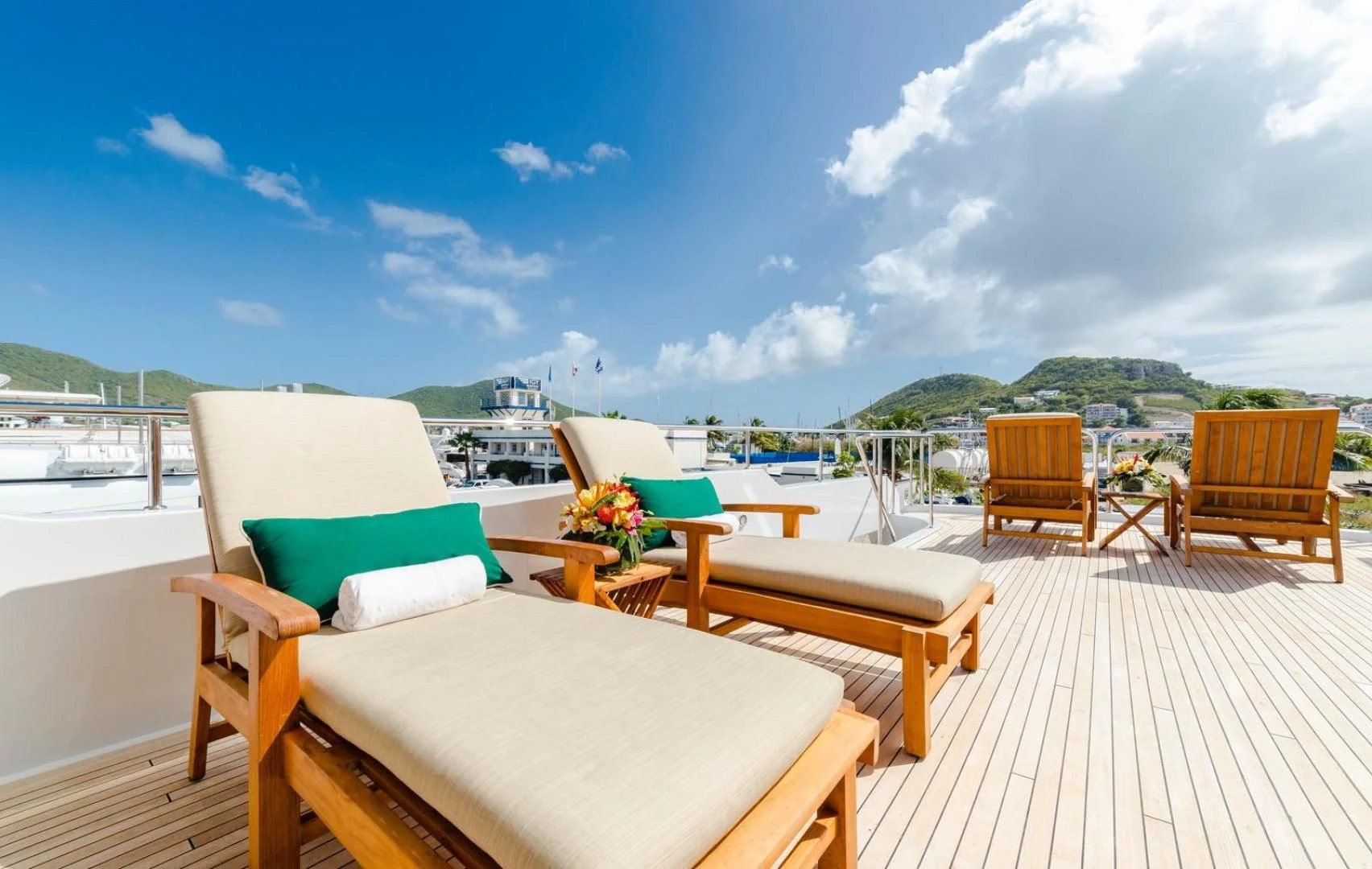 a deck with chairs and tables on it aboard POPEYE Yacht for Sale