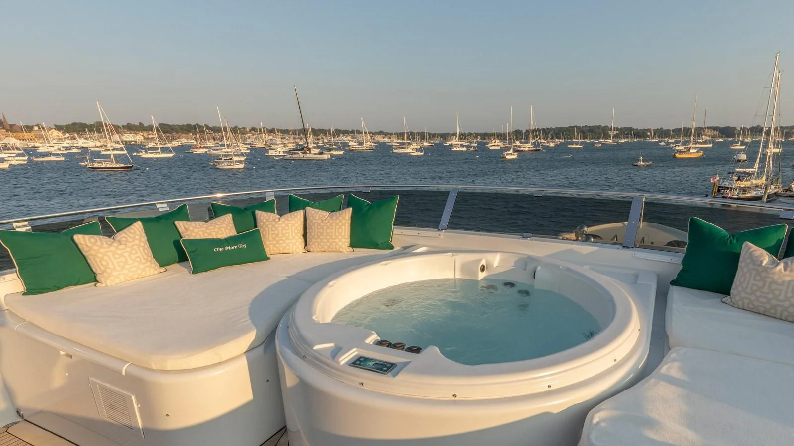 a pool with a view of the water and boats in the background aboard POPEYE Yacht for Sale