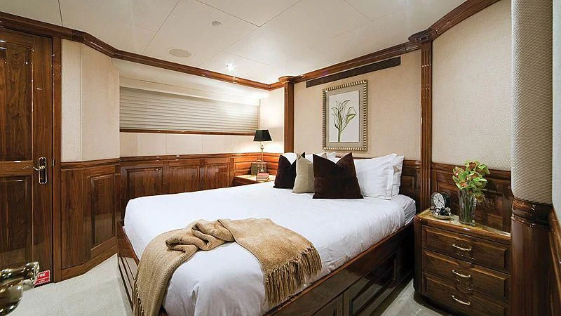a bed in a room aboard POPEYE Yacht for Sale