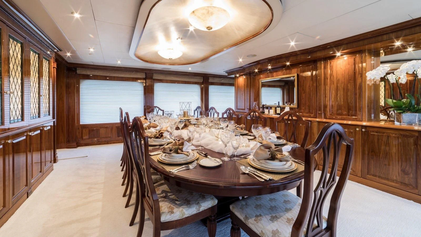 a dining room with a table set aboard POPEYE Yacht for Sale