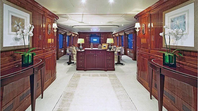 a room with a few people in it aboard POPEYE Yacht for Sale