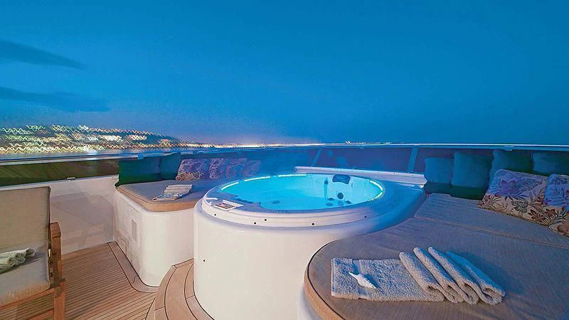 a pool with a large deck and a view of the water aboard POPEYE Yacht for Sale