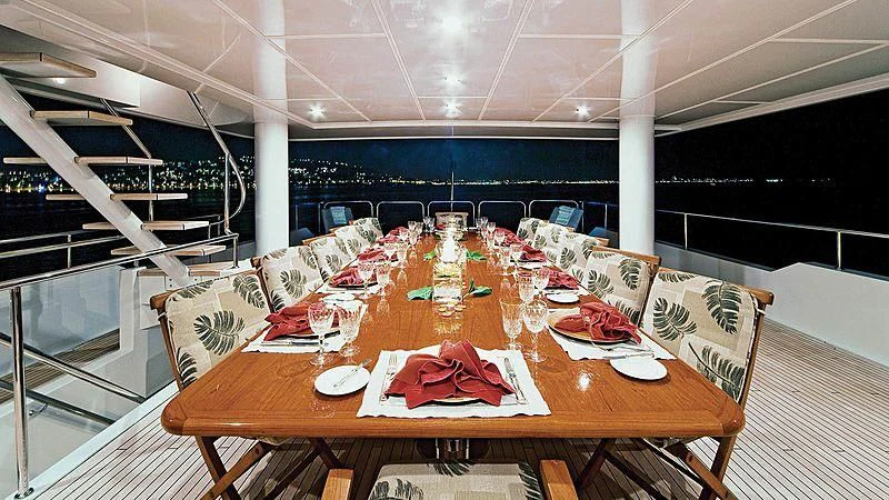 a table set for a dinner party aboard POPEYE Yacht for Sale