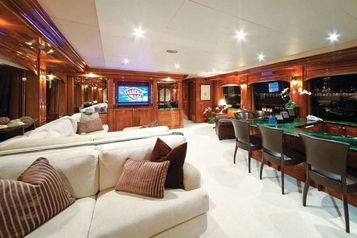 a living room with a couch and a television aboard POPEYE Yacht for Sale