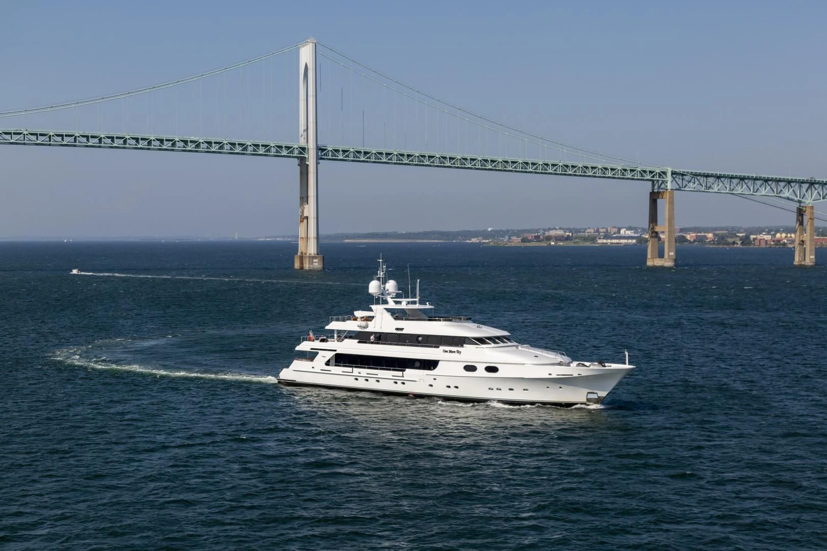 a boat sailing under a bridge aboard POPEYE Yacht for Sale