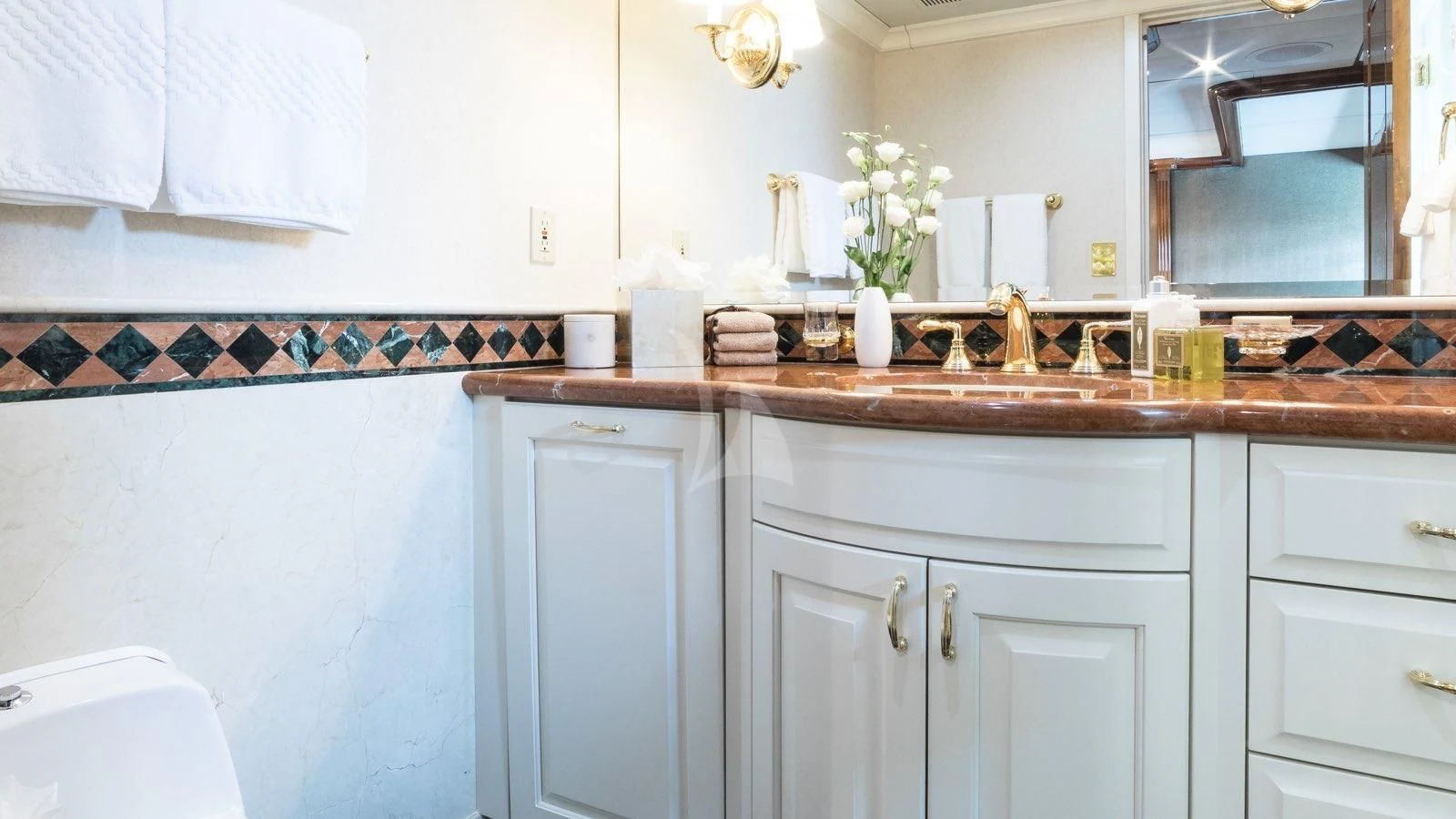 a kitchen with white cabinets aboard POPEYE Yacht for Sale