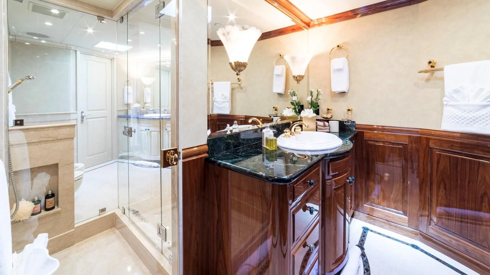 a bathroom with a glass shower aboard POPEYE Yacht for Sale