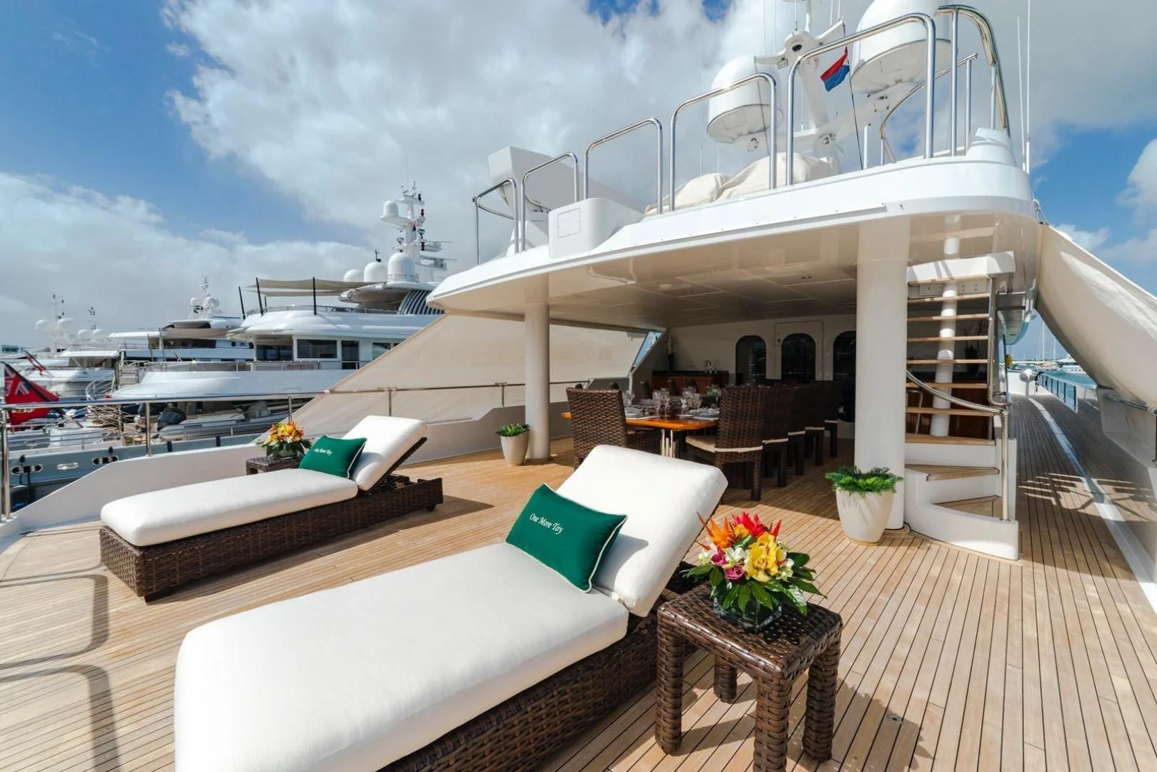 a deck with a large ship in the background aboard POPEYE Yacht for Sale