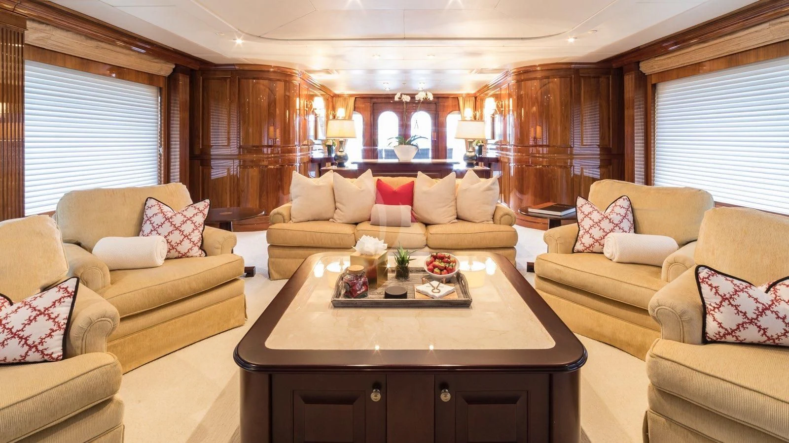 a living room with a table and couches aboard POPEYE Yacht for Sale