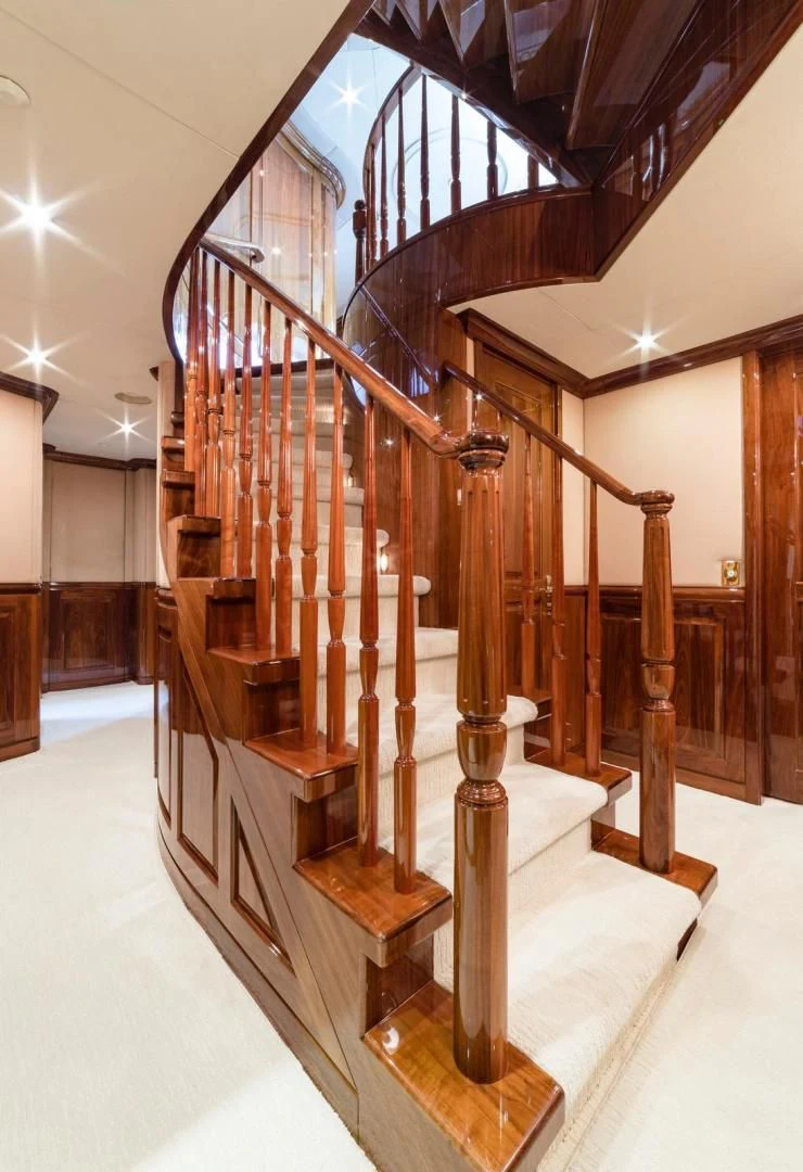 a staircase with wooden railings aboard POPEYE Yacht for Sale