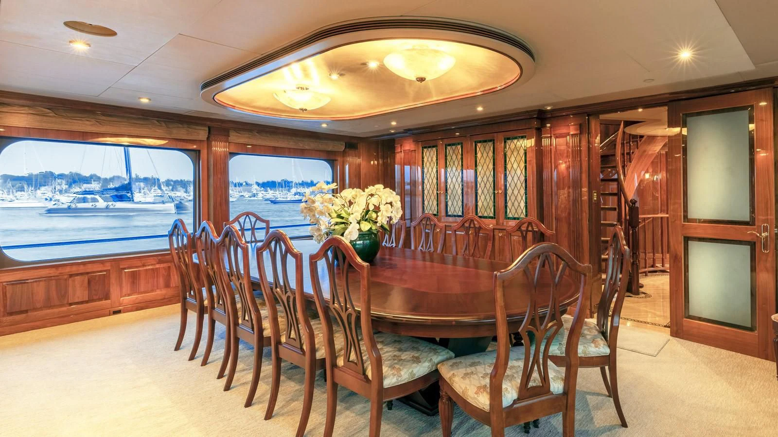 a dining room with a large window aboard POPEYE Yacht for Sale