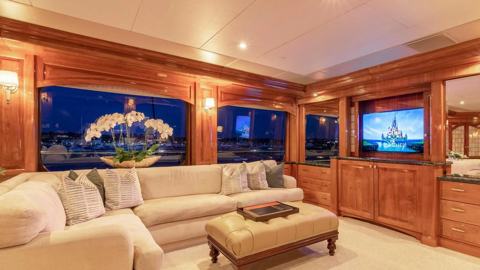 a living room with a large fish tank aboard POPEYE Yacht for Sale