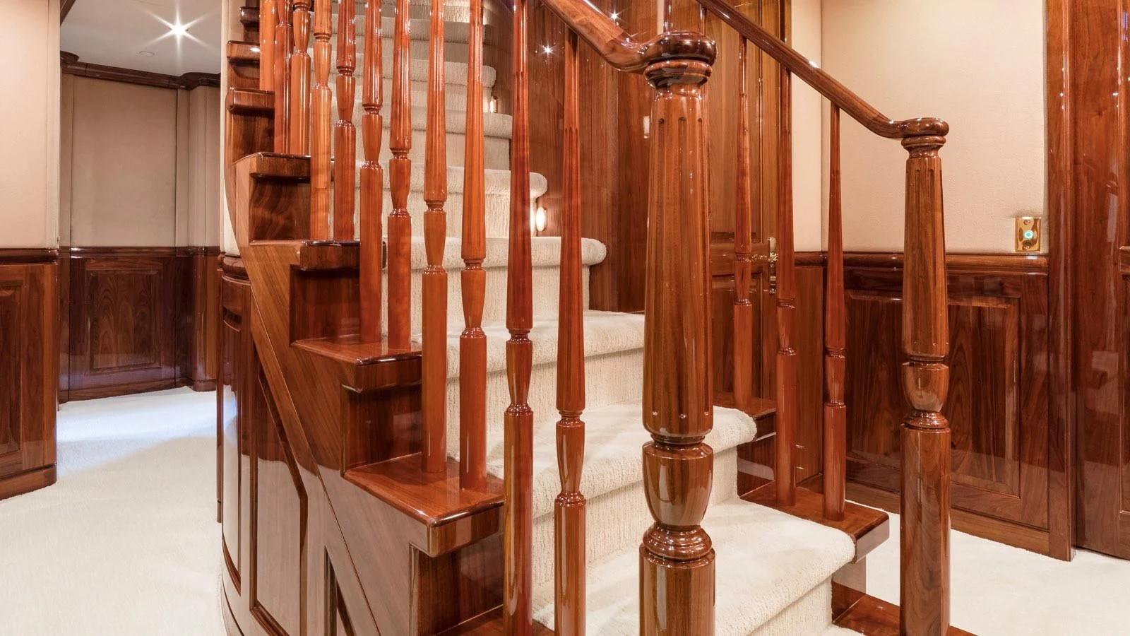 a wooden staircase with wooden railings aboard POPEYE Yacht for Sale