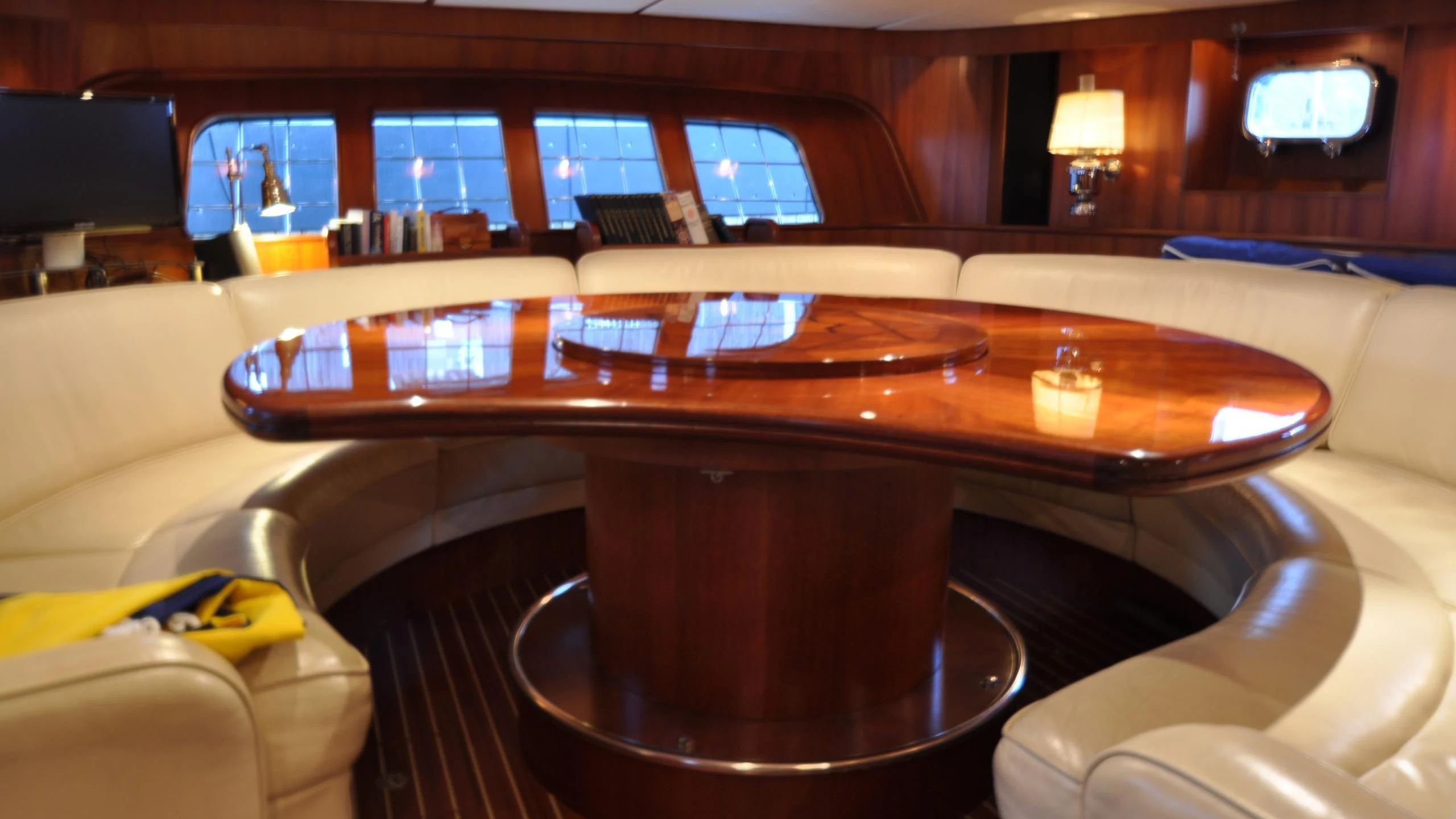 a large wooden table in a room aboard ISABEL Yacht for Sale