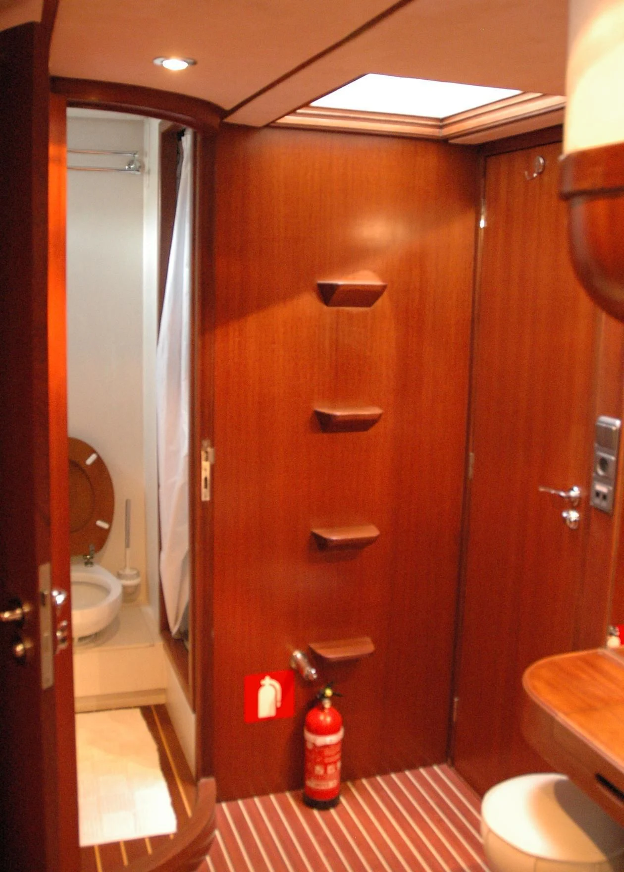 a bathroom with a toilet and a shower unit aboard ISABEL Yacht for Sale
