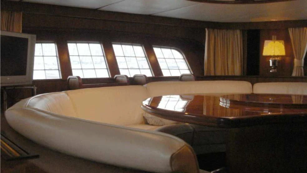 a large living room with a large couch and a tv aboard ISABEL Yacht for Sale
