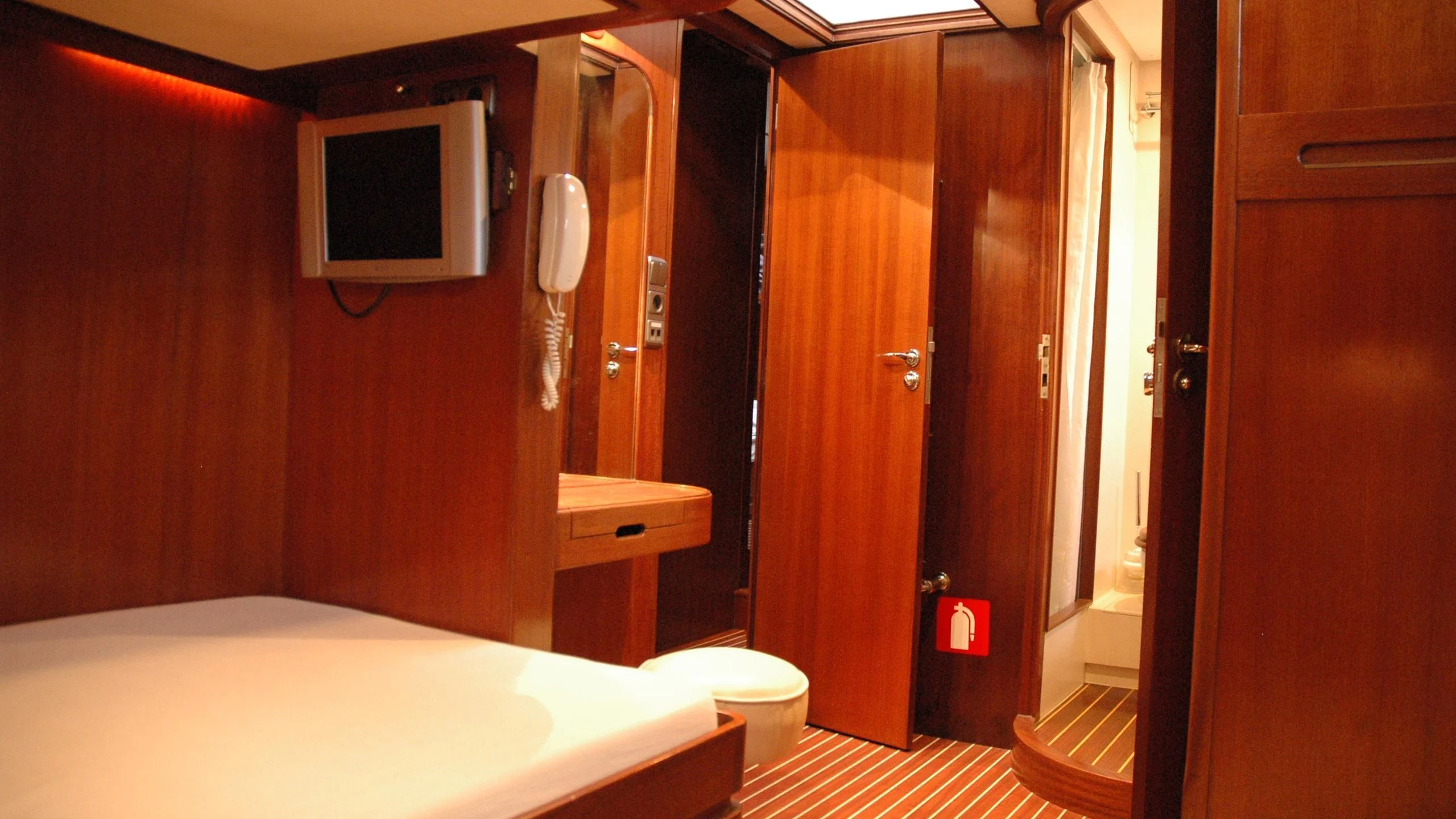 a bathroom with a bed and a television aboard ISABEL Yacht for Sale