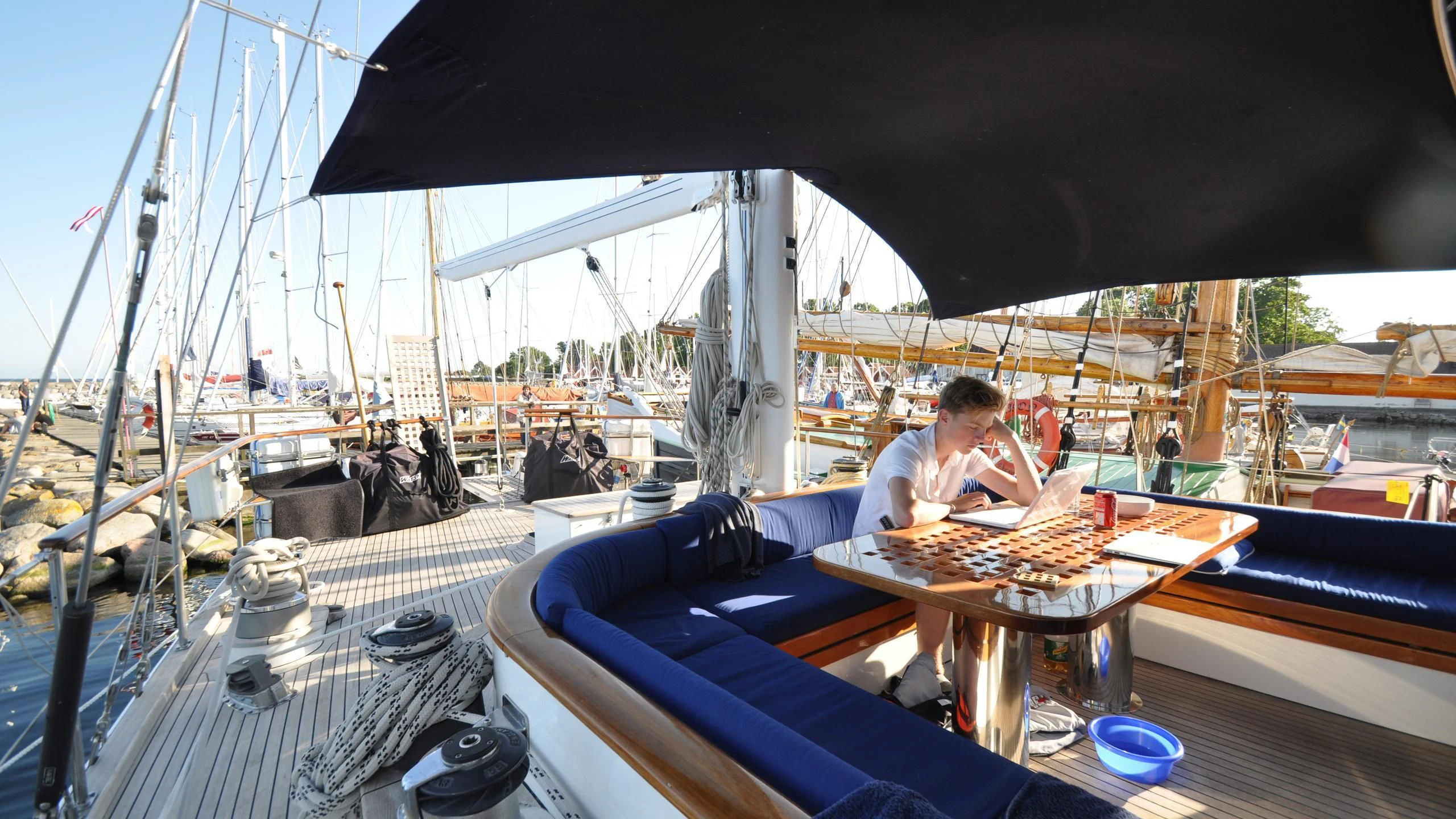 a couple of people sitting at a table with food on it aboard ISABEL Yacht for Sale