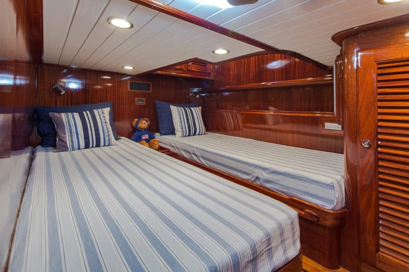a couple of beds in a cabin aboard REVELRY Yacht for Sale