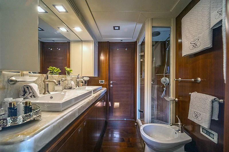 a bathroom with a countertop sink and mirrors aboard SEVENTH SENSE Yacht for Charter