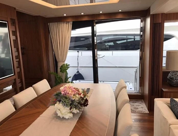 a table with flowers on it aboard ZODIAC Yacht for Sale