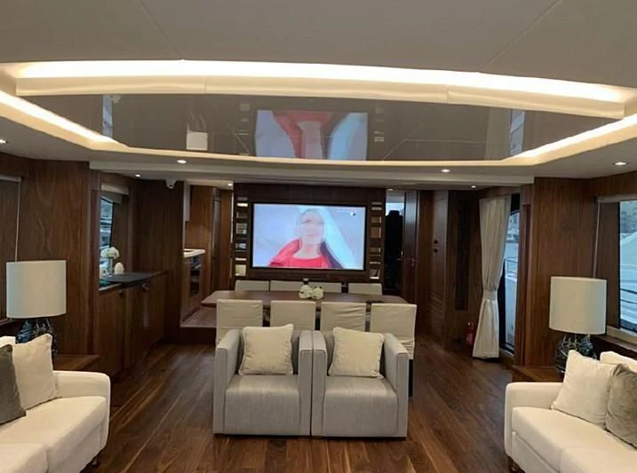 a living room with a large television aboard ZODIAC Yacht for Sale
