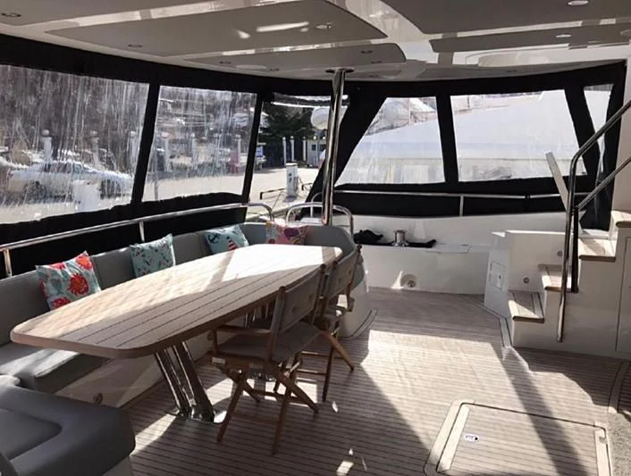 a room with a table and chairs aboard ZODIAC Yacht for Sale