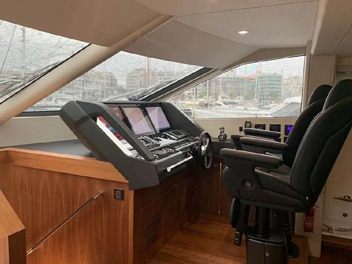 a desk with a laptop on it aboard ZODIAC Yacht for Sale