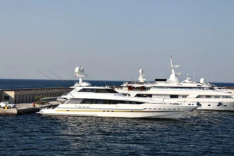 a white boat in the water aboard OBSESSIONS Yacht for Sale